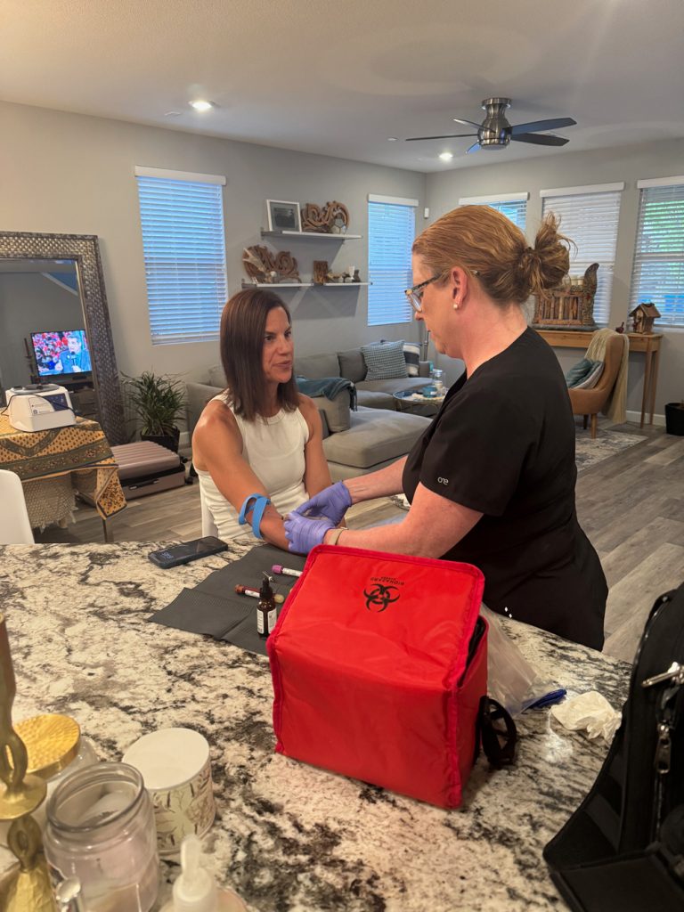 OptimizeTX provider reviewing lab results face to face with a client at home