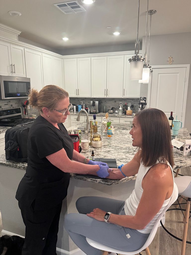 OptimizeTX nurse performing a mobile blood draw at a client's home in Las Vegas